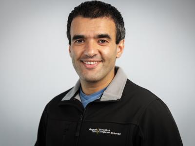 man in a pullover smiling