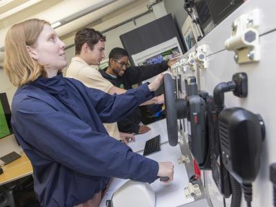 A woman working on a simulated ship