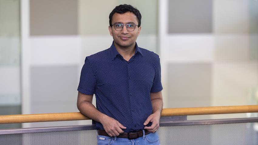 Man standing in front of railing.